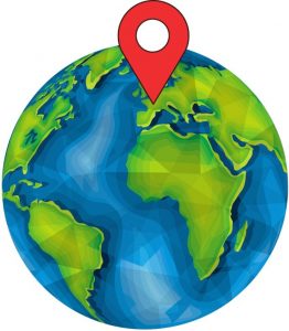 Un globe terrestre avec le symbole de Google Maps marquant un endroit précis en France